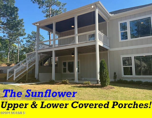 rear view of house with a wooden deck and a lawn