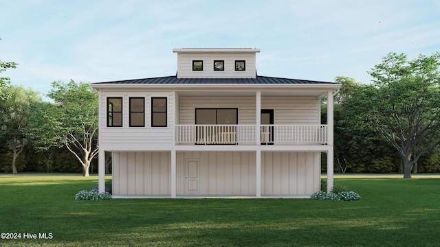 1550 Windsong Dr SW, Ocean Isle Beach, NC 28469 - view of front of home with a front lawn, a balcony, a standing seam roof, and metal roof