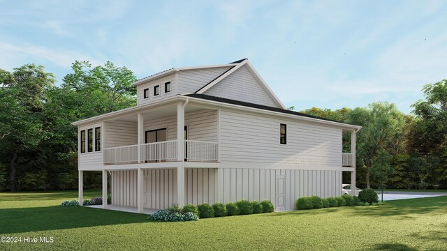 1550 Windsong Dr SW, Ocean Isle Beach, NC 28469 - view of side of property featuring a balcony, a yard, board and batten siding, and view of wooded area