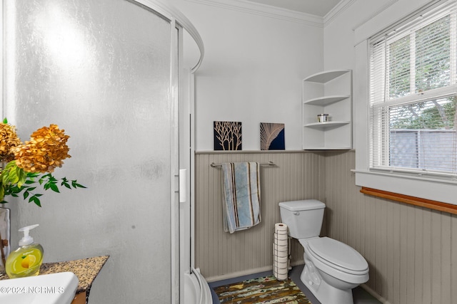 bathroom featuring vanity, wood walls, ornamental molding, and a shower with shower door