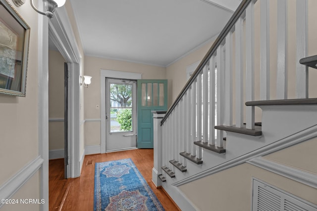 403 Ave D, New Bern, NC 28560 - entrance foyer featuring stairs, wood finished floors, and crown molding