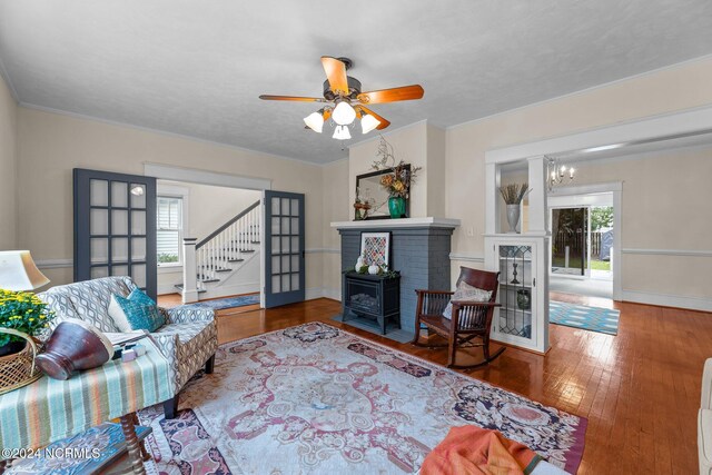 403 Ave D, New Bern, NC 28560 - living area featuring wood finished floors, baseboards, stairs, and a ceiling fan