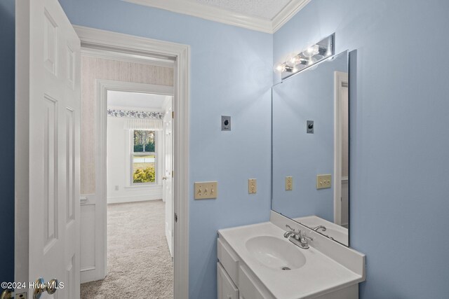 full bathroom featuring tub / shower combination, ornamental molding, vanity, a textured ceiling, and toilet