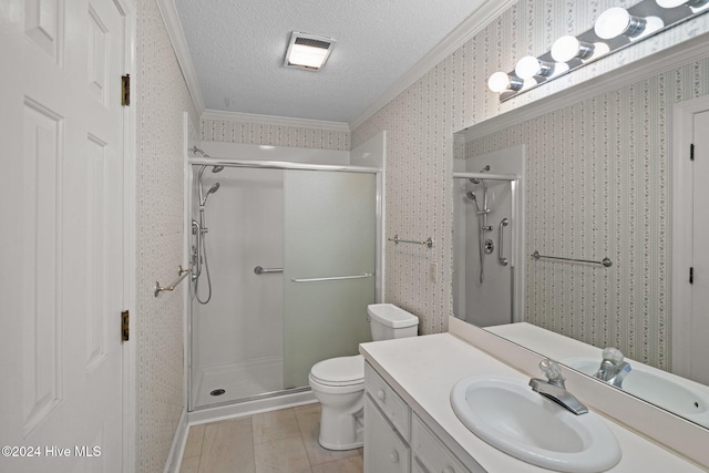 bathroom featuring tile patterned floors, a textured ceiling, crown molding, toilet, and a shower with shower door