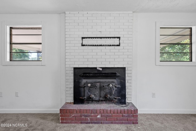 details with a textured ceiling and carpet floors