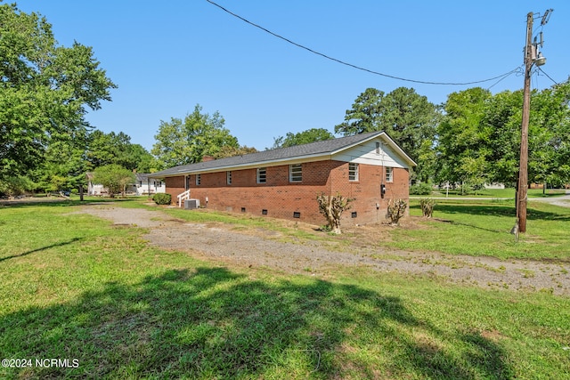 view of home's exterior featuring a yard