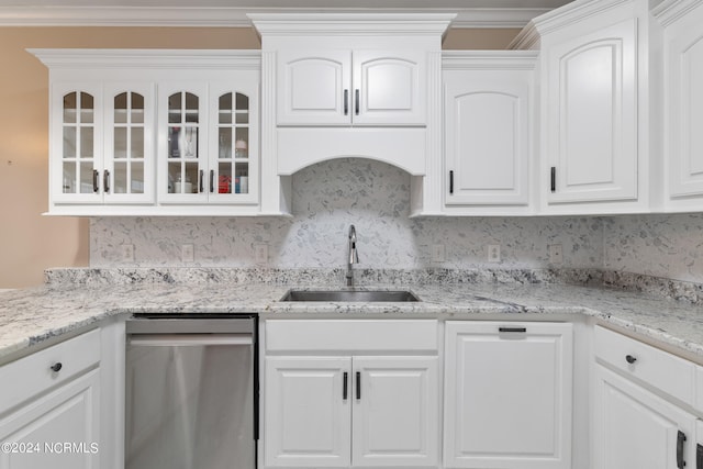 kitchen with white cabinetry, ornamental molding, sink, and stainless steel dishwasher