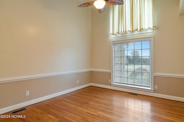 unfurnished room featuring ceiling fan and light hardwood / wood-style flooring