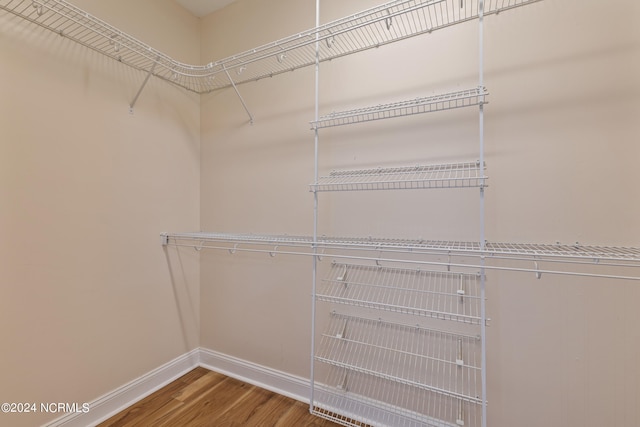 walk in closet featuring hardwood / wood-style floors