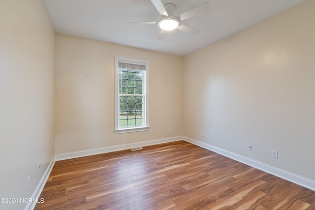 empty room featuring wood-type flooring and ceiling fan