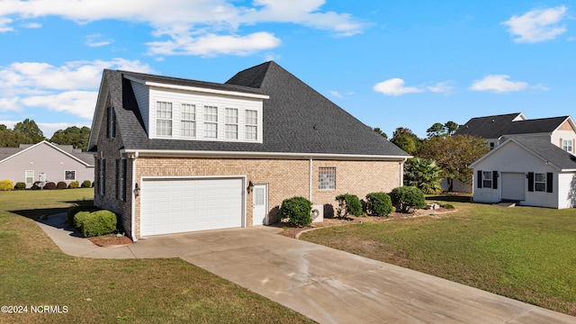 view of front of house with a front yard and a garage