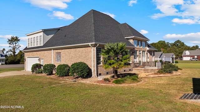 view of property exterior featuring a yard and a garage