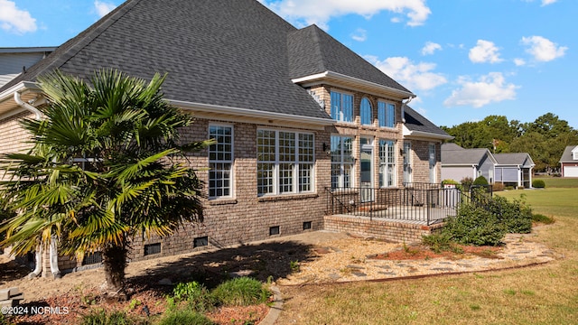 back of house featuring a yard