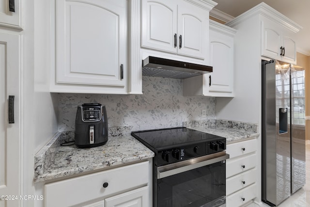 kitchen with white cabinetry, stainless steel appliances, light stone countertops, and ornamental molding