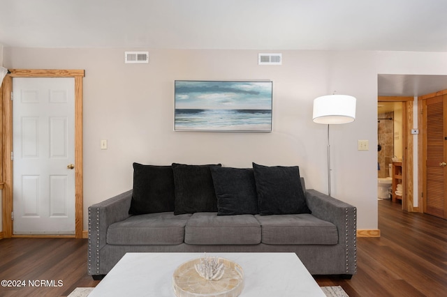 living room featuring dark hardwood / wood-style floors