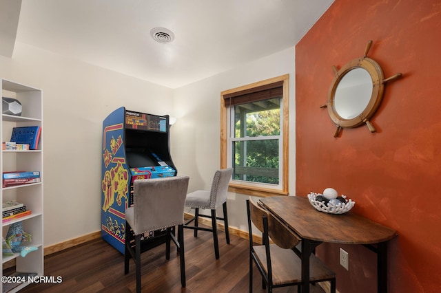 home office with dark wood-type flooring