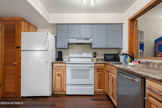 kitchen featuring gray cabinets, sink, dark wood-type flooring, and white appliances