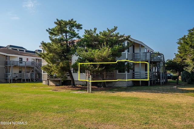 view of home's community with a lawn