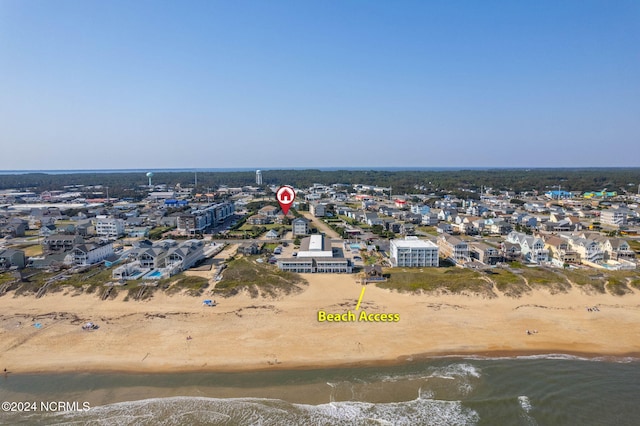 aerial view with a water view and a view of the beach