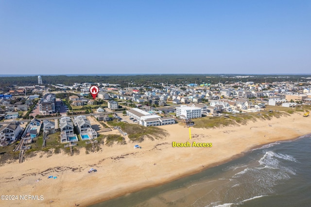 bird's eye view with a water view and a view of the beach