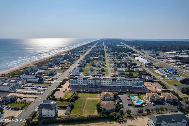 birds eye view of property featuring a water view and a view of the beach