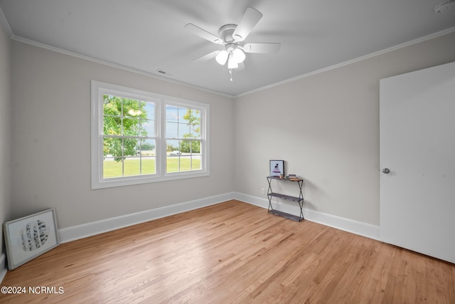 unfurnished room featuring ceiling fan, crown molding, and light hardwood / wood-style flooring