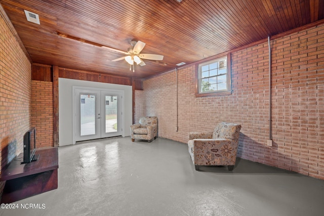 sitting room with brick wall