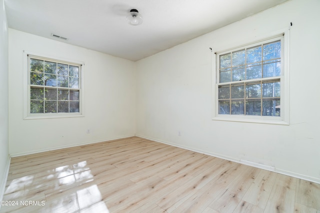 unfurnished room with light hardwood / wood-style flooring