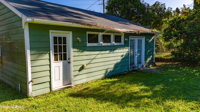 view of outbuilding with a yard