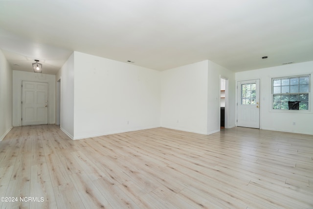 unfurnished living room with light hardwood / wood-style flooring