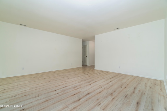 spare room with light wood-type flooring