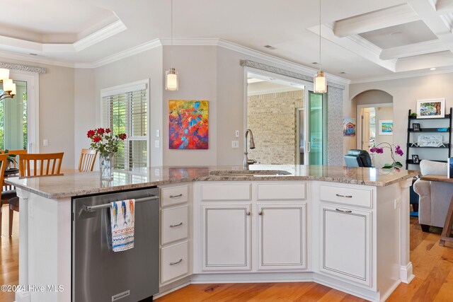 kitchen with light wood finished floors, arched walkways, a sink, dishwasher, and crown molding