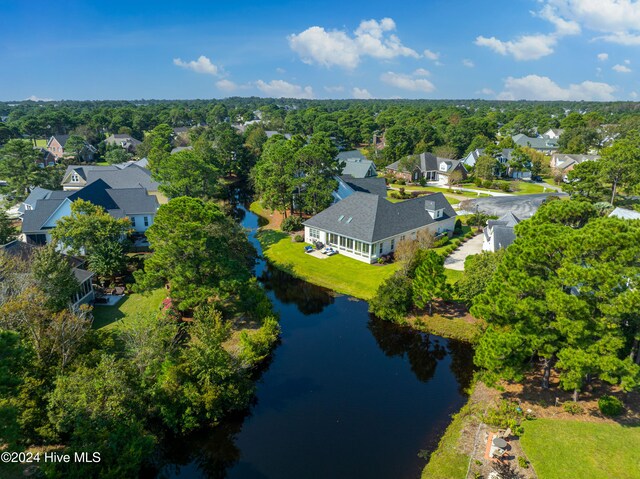 bird's eye view with a residential view and a water view