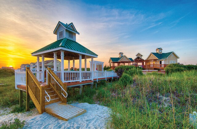 exterior space featuring a deck and a gazebo