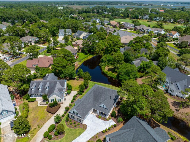 bird's eye view featuring a residential view and a water view