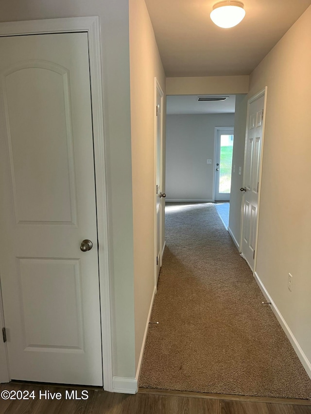 hall featuring wood-type flooring