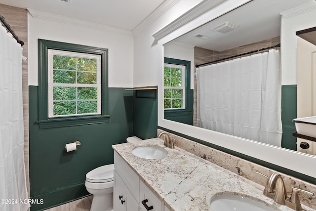 bathroom featuring vanity, toilet, ornamental molding, and hardwood / wood-style floors