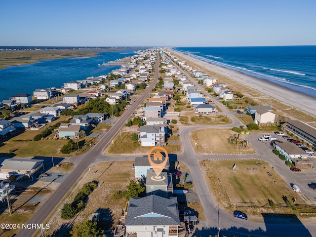 aerial view with a water view and a view of the beach