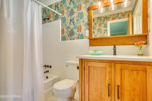 full bathroom featuring toilet, shower / bath combo, vanity, and tile walls