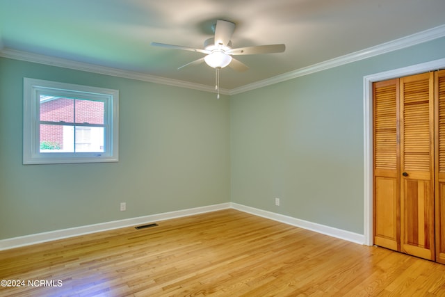 interior space featuring light hardwood / wood-style flooring, ceiling fan, and crown molding