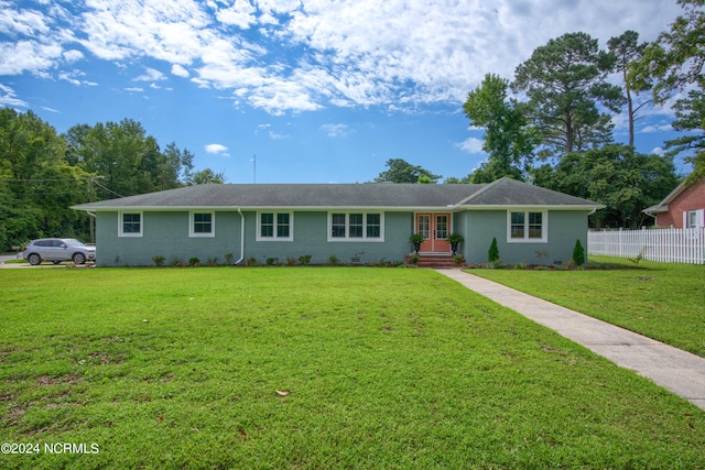 ranch-style home with a front yard