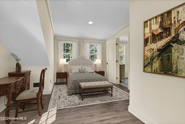 bedroom featuring dark hardwood / wood-style floors and crown molding