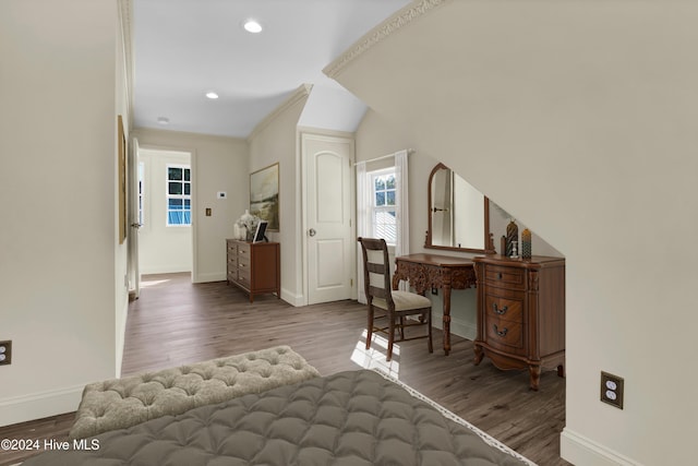 office with wood-type flooring and ornamental molding