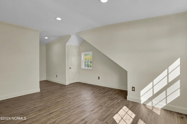 bonus room featuring wood-type flooring and vaulted ceiling