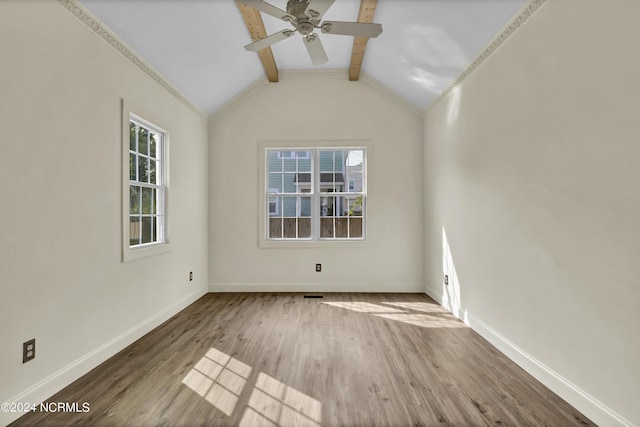 spare room with vaulted ceiling with beams, ceiling fan, and hardwood / wood-style flooring