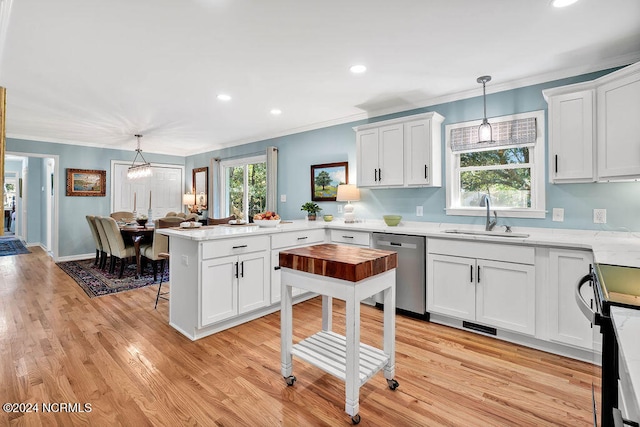 kitchen with sink, dishwasher, kitchen peninsula, white cabinetry, and pendant lighting