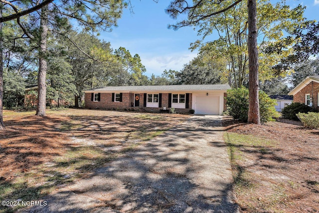 ranch-style house featuring a garage