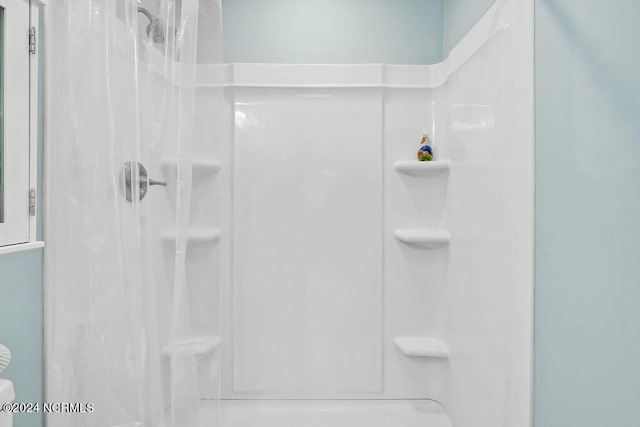 bathroom with a shower with shower curtain