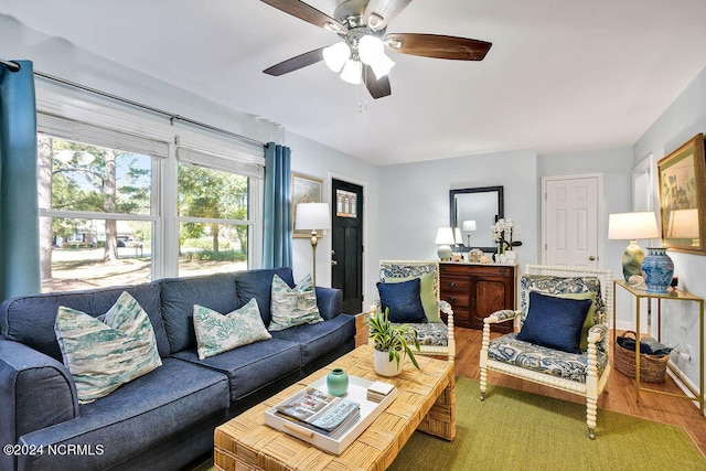 living room with hardwood / wood-style flooring and ceiling fan