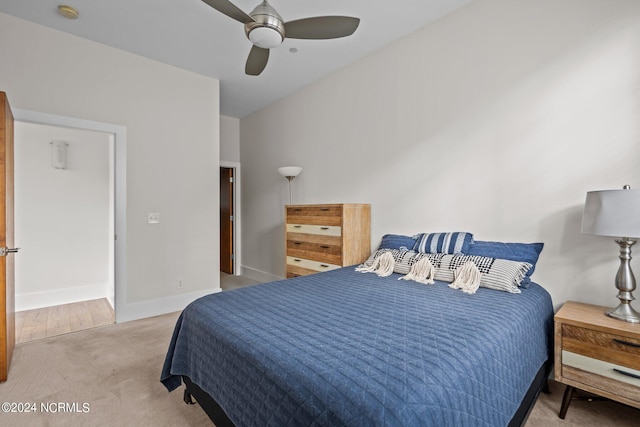 bedroom with ceiling fan and light colored carpet